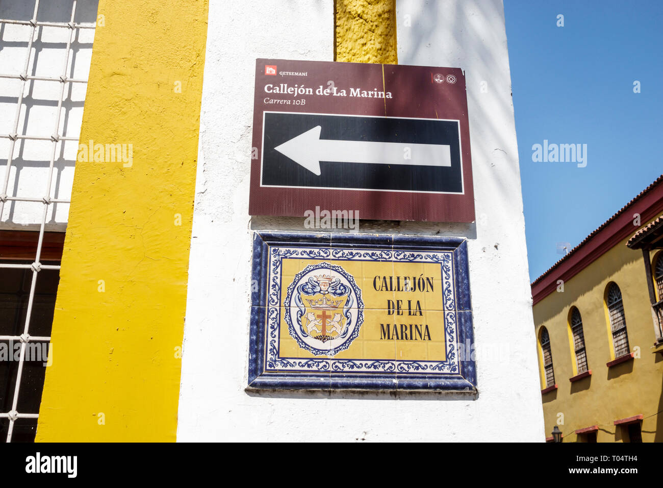 Cartagena Colombia,Center,centre,Getsemani,Callejon de la Marina,tile street sign,traffic one-way arrow,COL190120019 Stock Photo