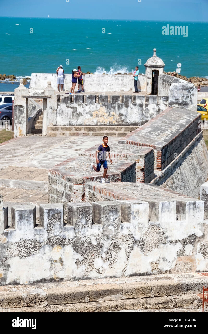 Cartagena Colombia,Caribbean Sea,Baluarte de Santa Catalina,coastline fortification,Black Afro Caribbean,boy boys,male kid kids child children youngst Stock Photo