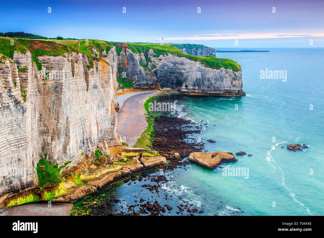 Fantastic travel location, admirable limestone coastline with green fields and Atlantic ocean, English (La Manche) Channel, Normandy, Etretat, France, Stock Photo