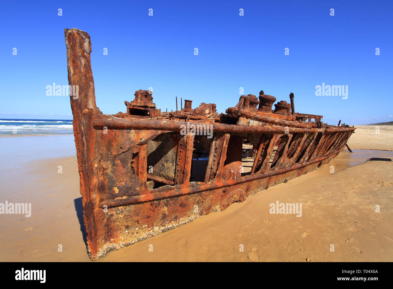 The SS Maheno ship wreck on Fraser Isand.   It was washed ashore by a cyclone in 1935 when it was being towed from Sydney to Japan to be scrapped. Stock Photo