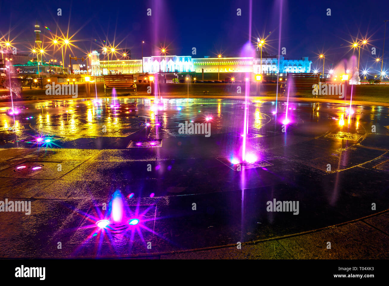 Colorful water fountain at Souq Waqif Park at Doha Corniche illuminated