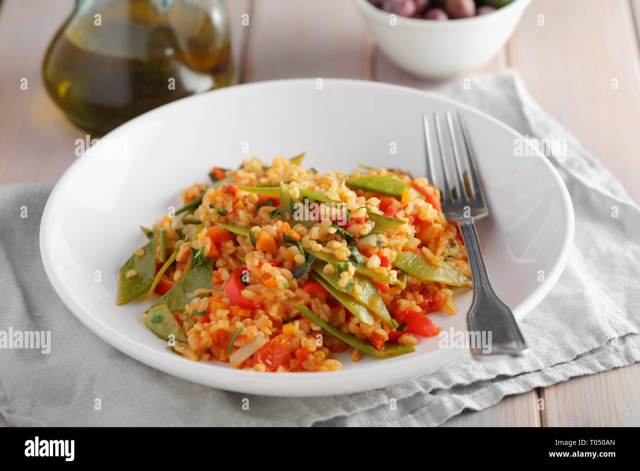 Bulgur Pilaf with Green Beans and red pepper Stock Photo