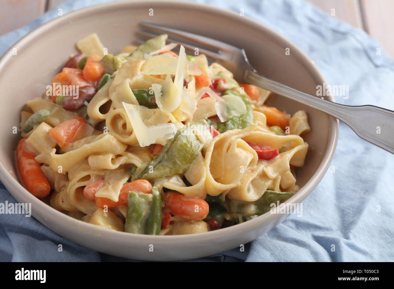 Spring Vegetable Fettuccine Alfredo with Parmesan cheese Stock Photo