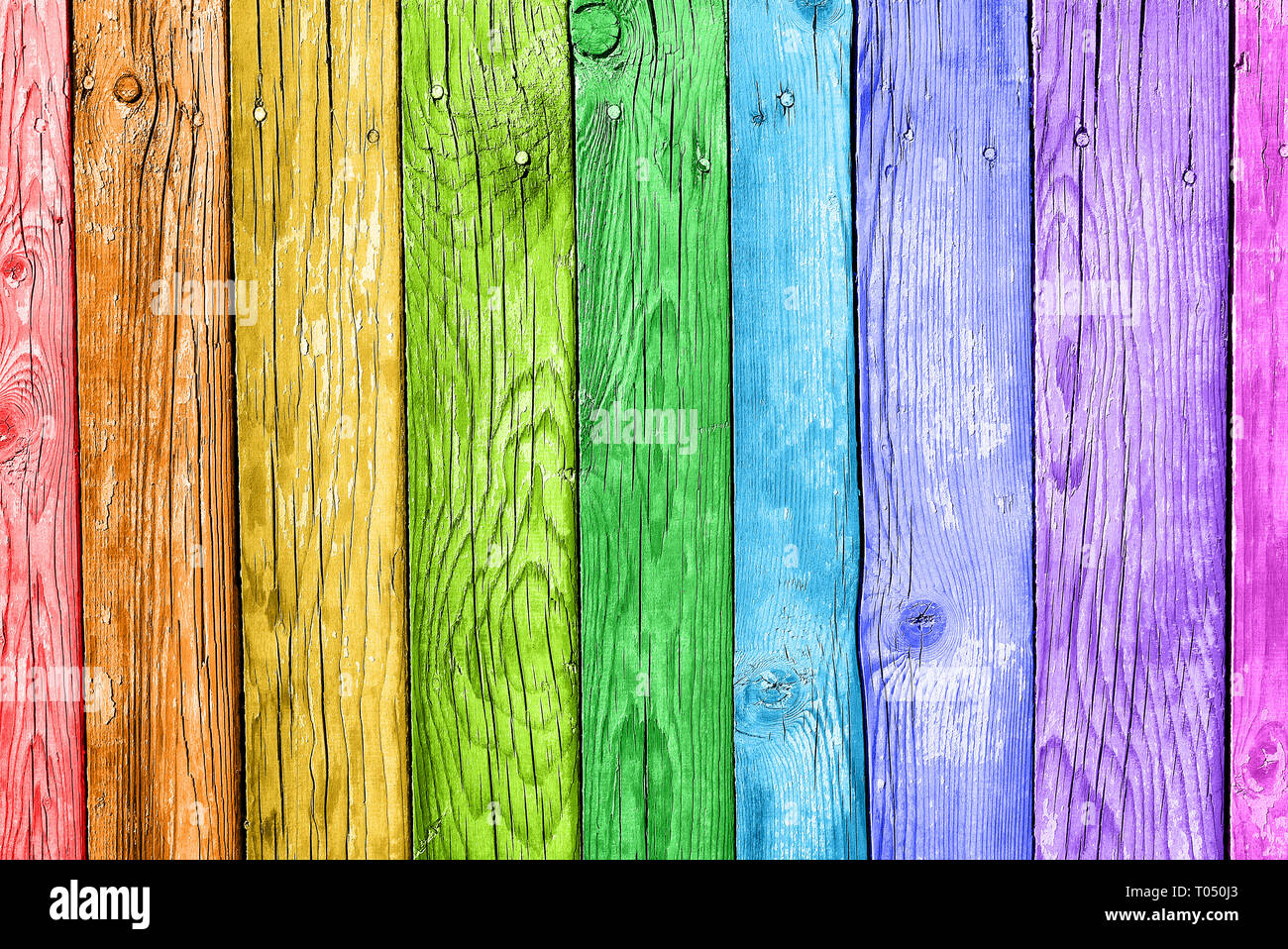 Old planks in the colors of the rainbow. Colorful wood background Stock Photo
