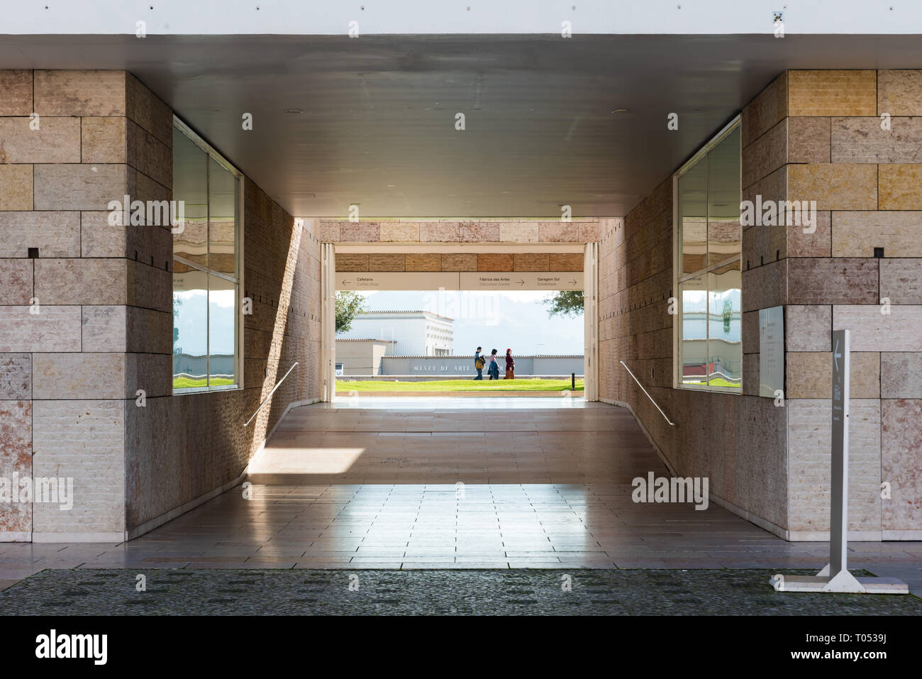 Belem, Lisbon / Portugal - 12 28 2018: Silhouettes of three people walking next to the museum of contemporary art Stock Photo