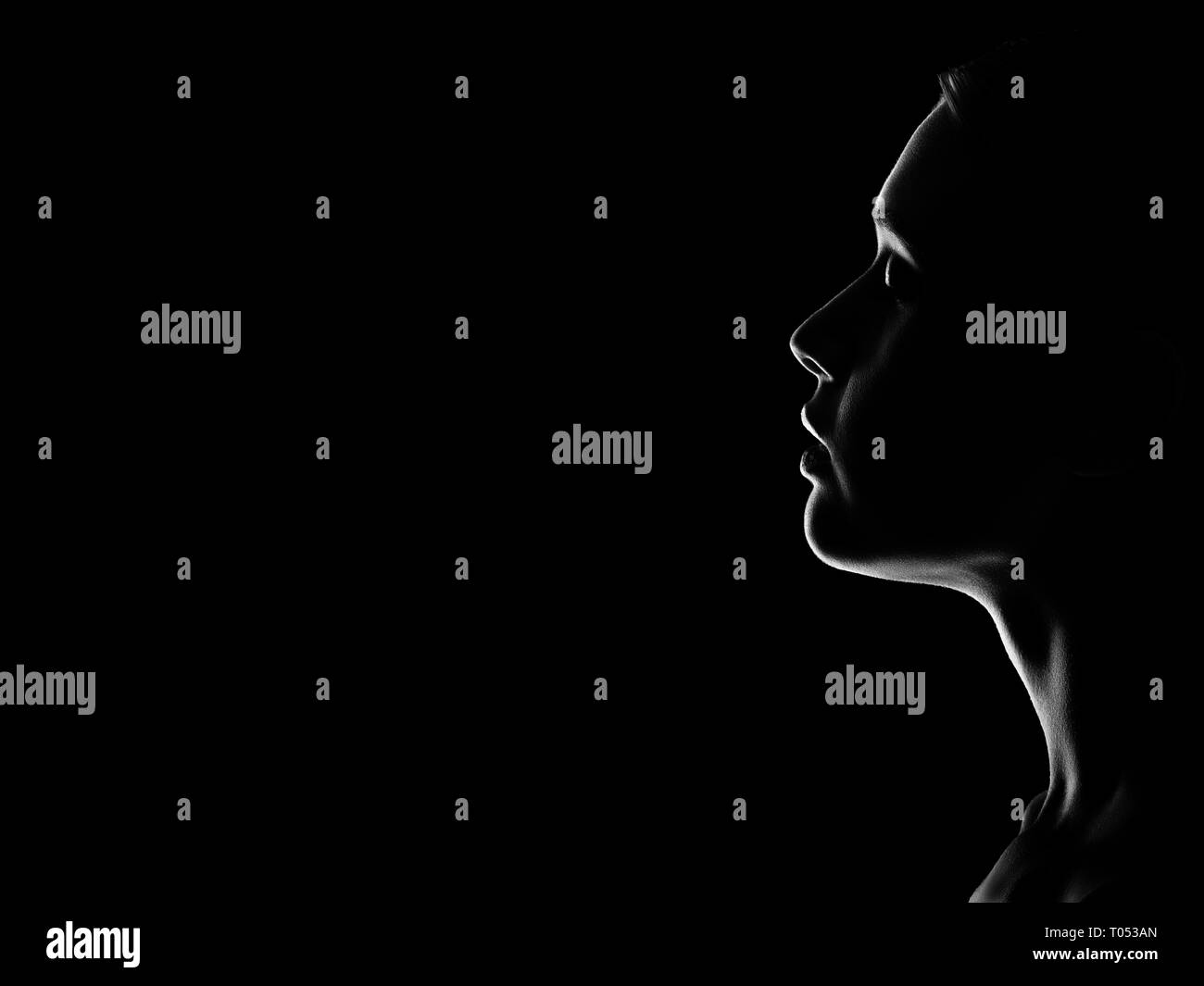sad woman profile silhouette on black background with copy space, closed  eyes, monochrome Stock Photo - Alamy