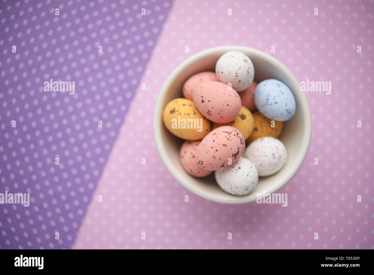 Easter candy egg on colorful background Stock Photo