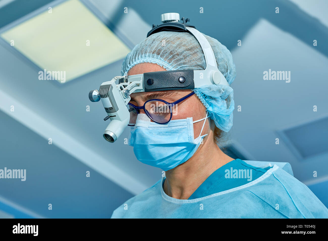 Close up portrait of female surgeon doctor wearing protective mask and ...