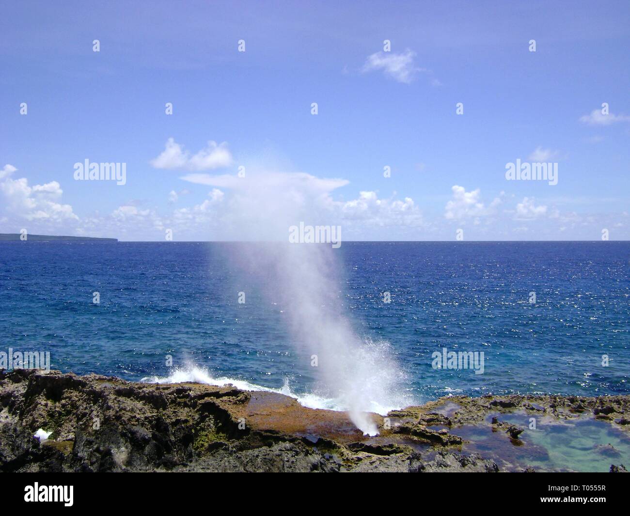 Wide shot of the famous Blow Hole in the North Field of Tinian, Northern Mariana Islands Stock Photo