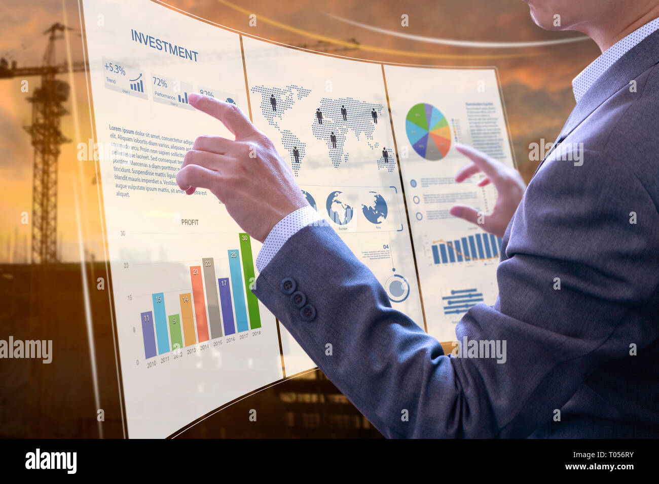 Businessman in front of modern virtual touch screen analysing on investment risk management and return on investment analysis on real estate building  Stock Photo