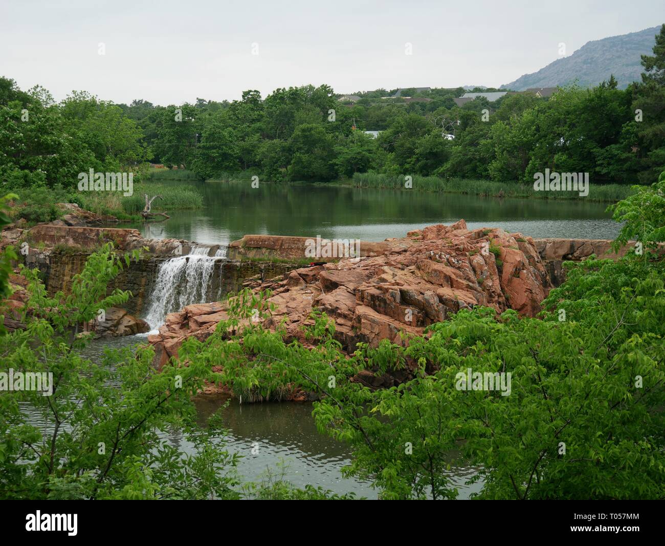 Wide shot of the scenic bath lake with waterfalls at Medicine Park