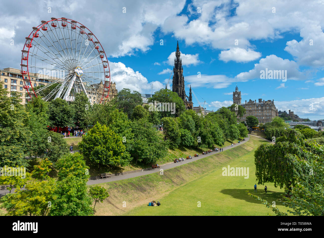A Ferris Wheel, the Scott Monument and the Balmoral Hotel over Princes Street Gardens, Edinburgh, Scotland, UK Stock Photo