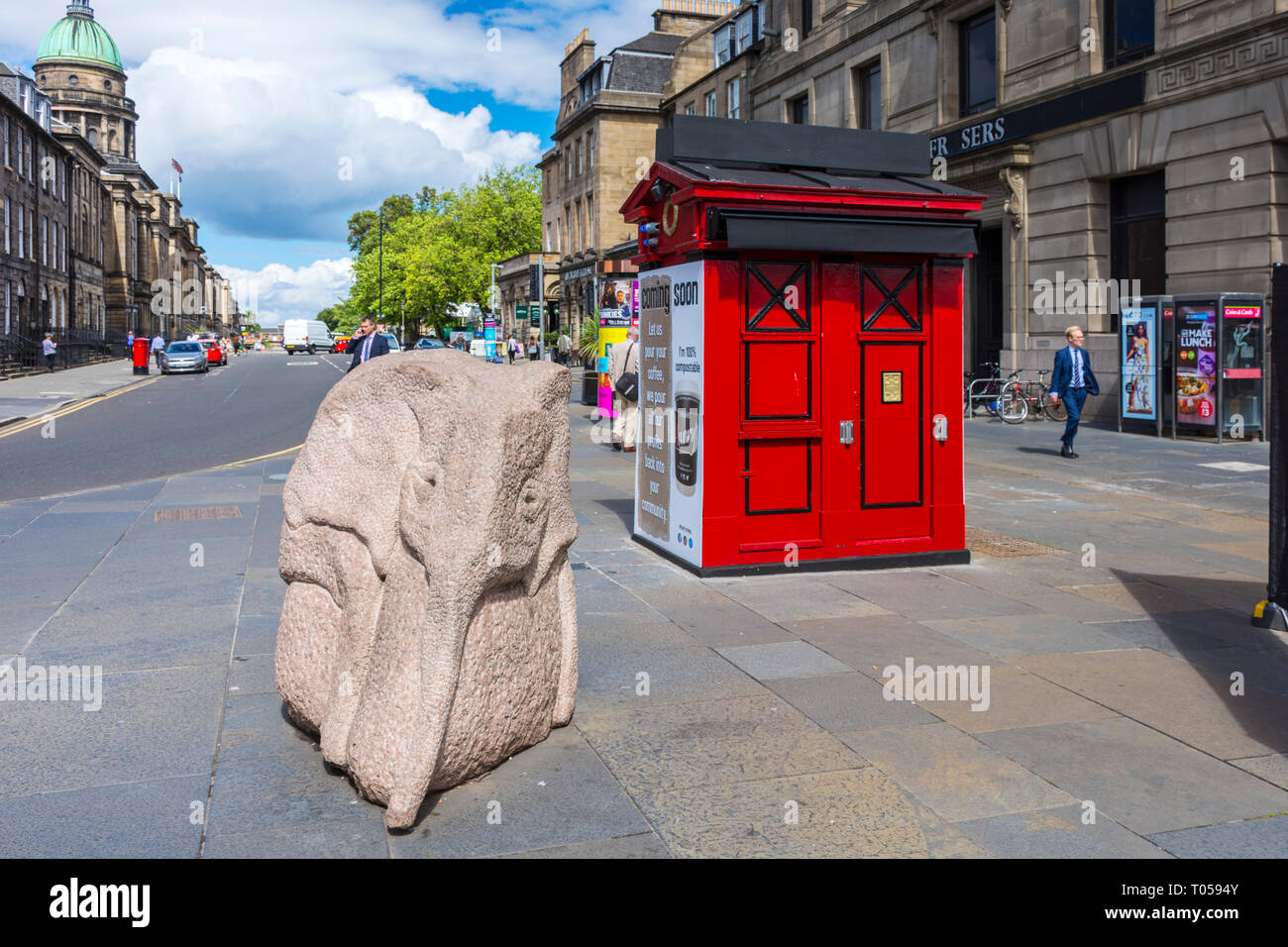 Baby Elephant, a sculpture by Ronald Rae, and a former Police Box on the corner of Hope Street and Princes Street, Edinburgh, Scotland, UK. Stock Photo