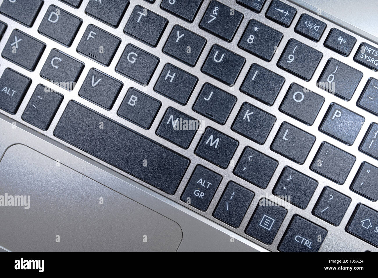 Close up keyboard of a laptop computer on focus at button Stock Photo