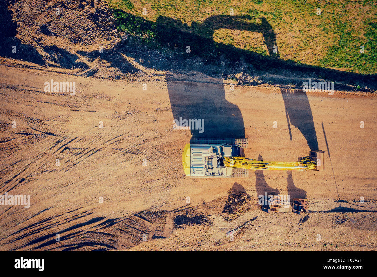 drone shot of a excavator at sunset Stock Photo