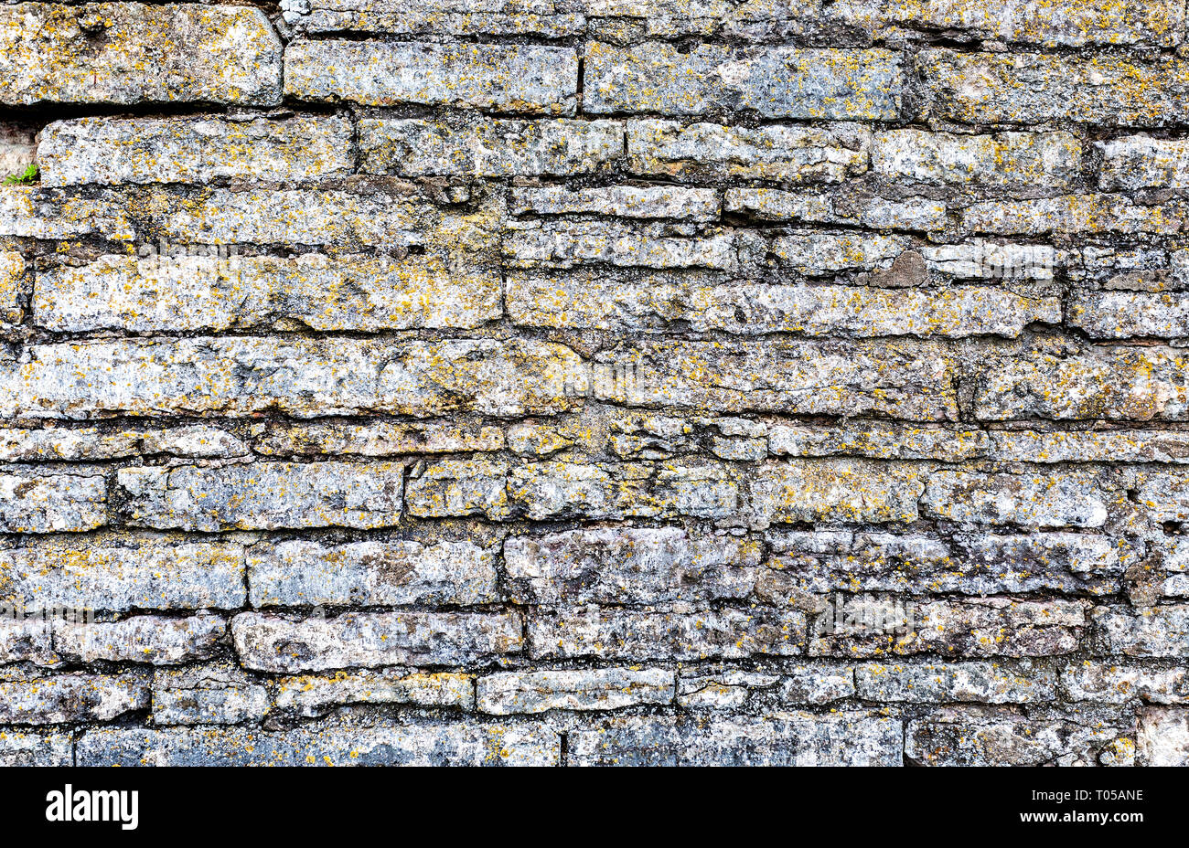 Rough weathered stone wall as creative background texture. Natural ...