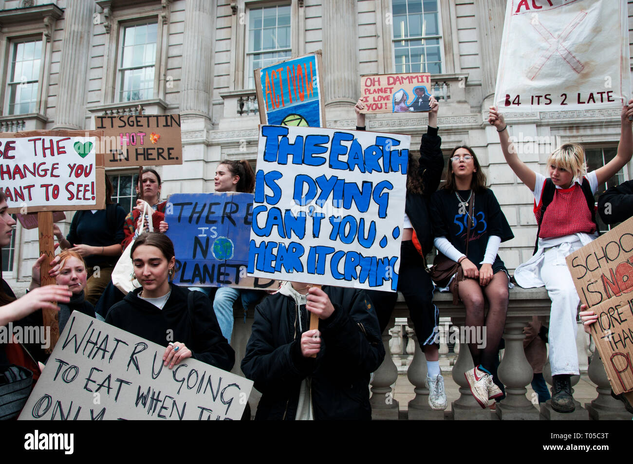 London. School students strike for climate change , part of a global action. Students with placards including one saying 'The earth is dying, can't yo Stock Photo