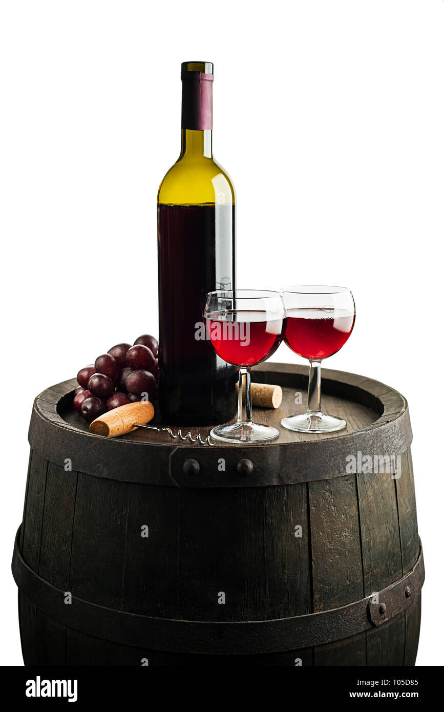 Glass and bottle of red wine on wooden barrel background isolated on ...