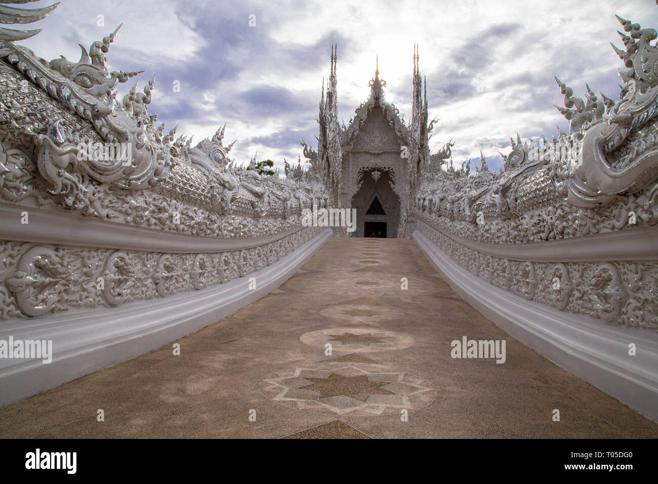 Temple highly visited by tourists in Chiang Rai, Wat Rong Khun, perhaps best known to Foreigners as the White Temple, is a contemporary, unconventiona Stock Photo