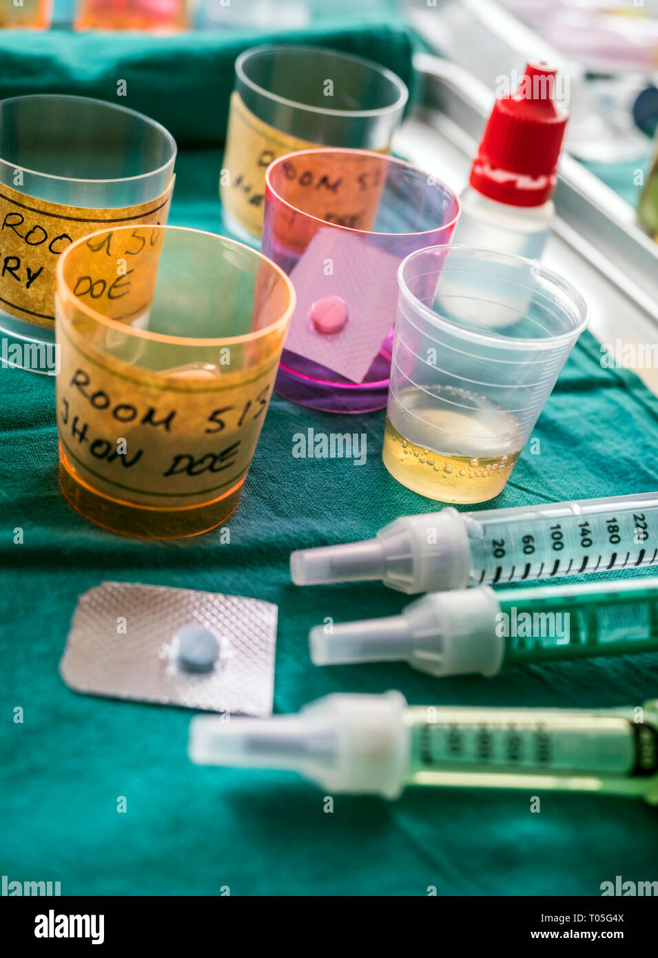 Diverse medication in glasses monodose along with insulin injectors in ...