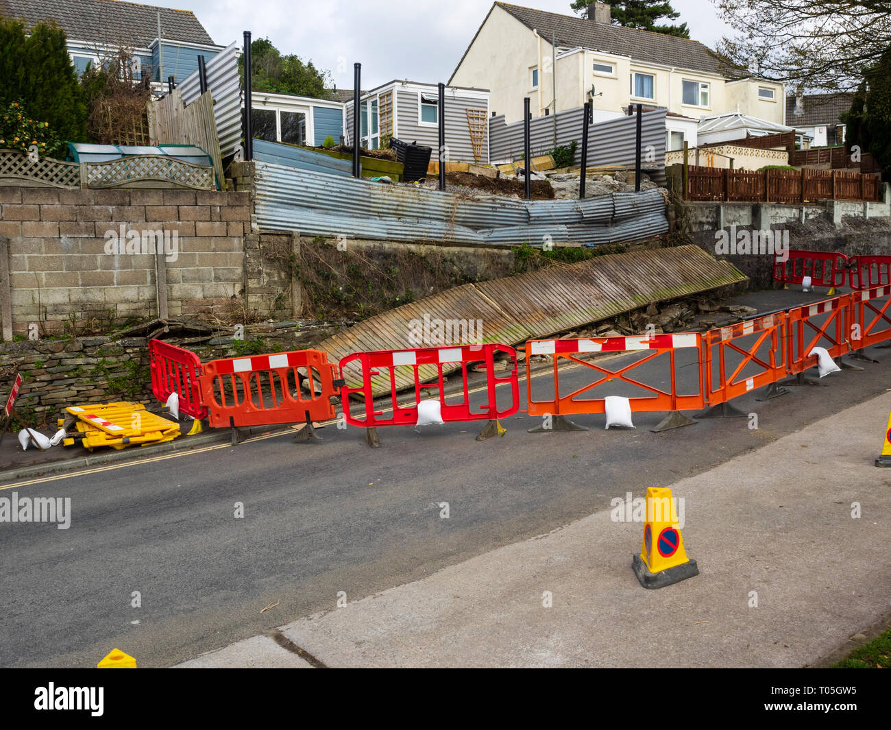 Wall collapse and road closure following March 2019 storm Gareth in a Plymouth street Stock Photo