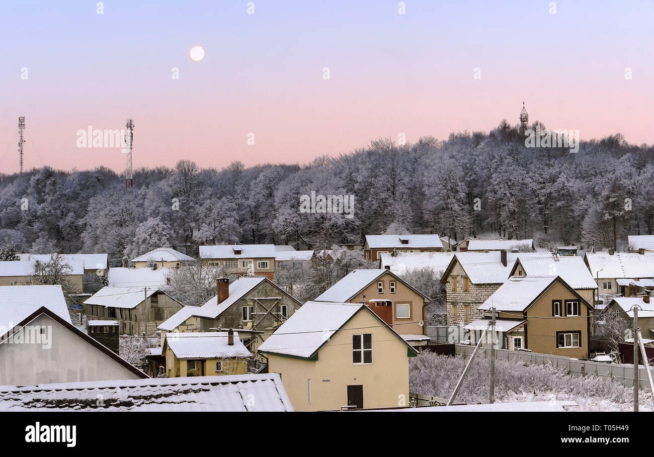 dawn in winter in the village, early frosty morning, Kholmogorovka village, Kaliningrad region, Russia, December 24, 2018 Stock Photo