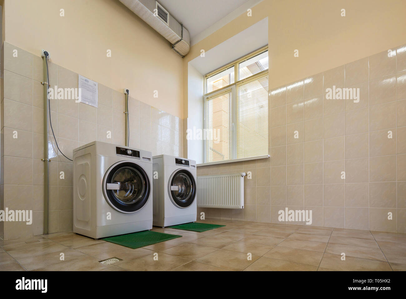 Modern New Industrial Washing Machines On Rubber Insulation Mats