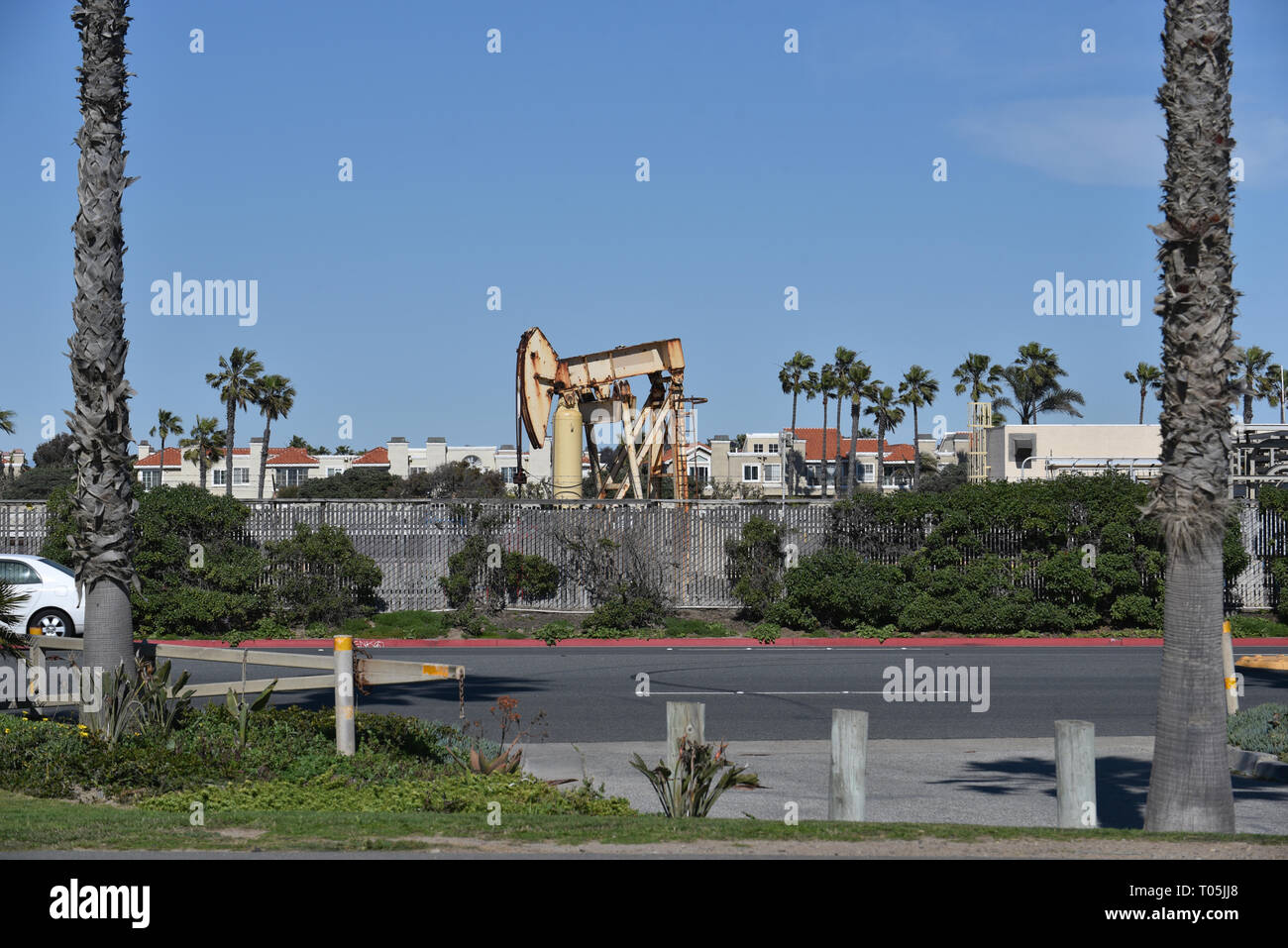 An oil pump jack in a residential neighborhood in Southern California