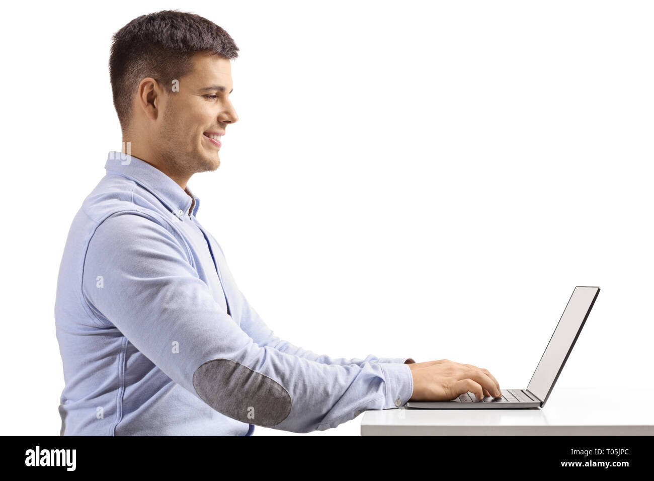 profile-shot-of-a-young-man-typing-on-a-laptop-isolated-on-white-background-T05JPC.jpg