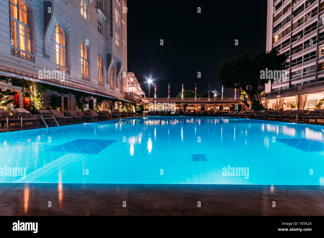 Rio de Janeiro, Brazil, March 17, 2019: Poolside bar and lounge chairs at luxurious Copacabana Palace Belmond in Copacabana, Rio de Janeiro, Brazil Stock Photo