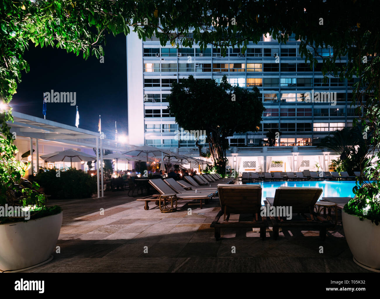 Rio de Janeiro, Brazil, March 17, 2019: Poolside bar and lounge chairs at luxurious Copacabana Palace Belmond in Copacabana, Rio de Janeiro, Brazil Stock Photo