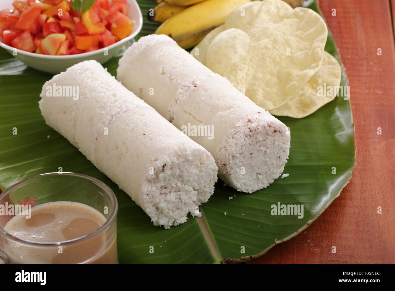 Kerala white rice puttu on banana leaf Stock Photo Alamy