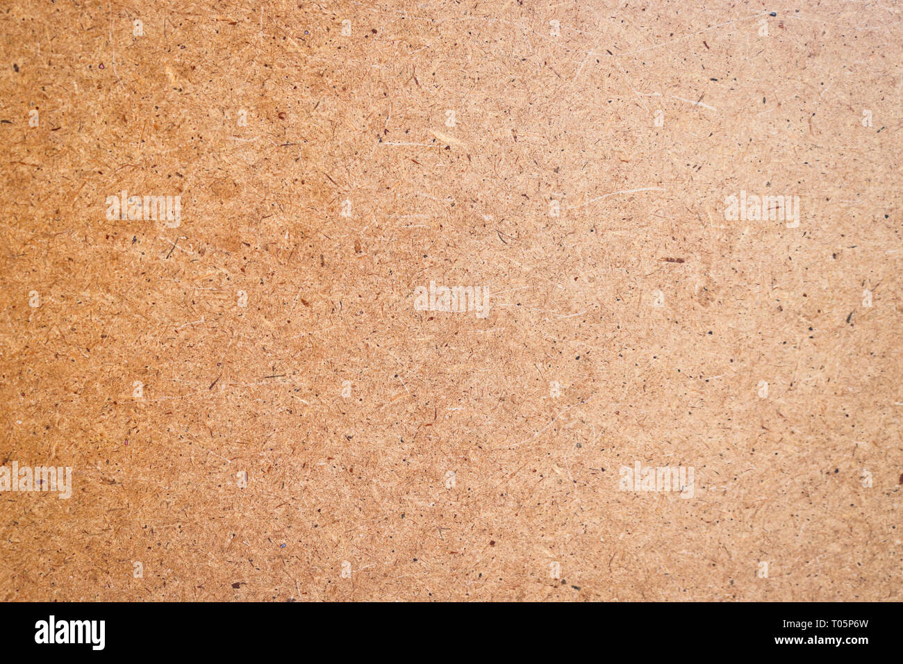 The texture of the fiberboard. Front side. Abstract background with copy space. Stock Photo