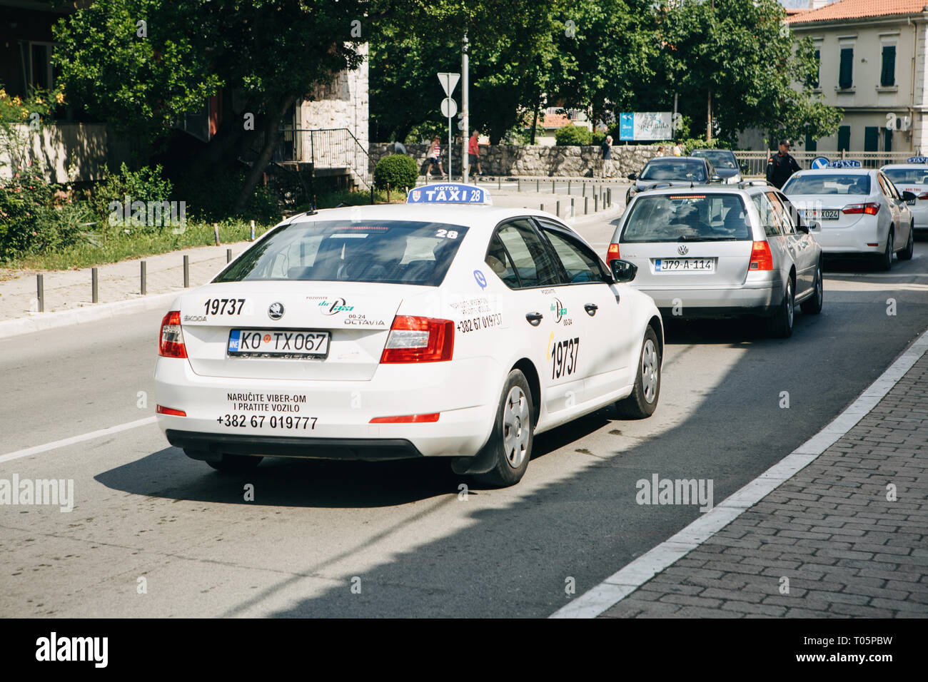 Montenegro, Kotor, June 27, 2018 A taxi car and other cars drive on
