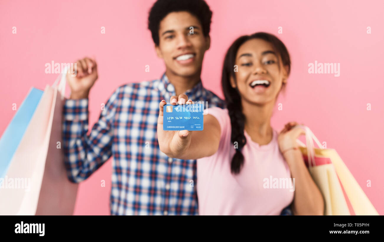 Teenagers with shopping bags and credit card Stock Photo