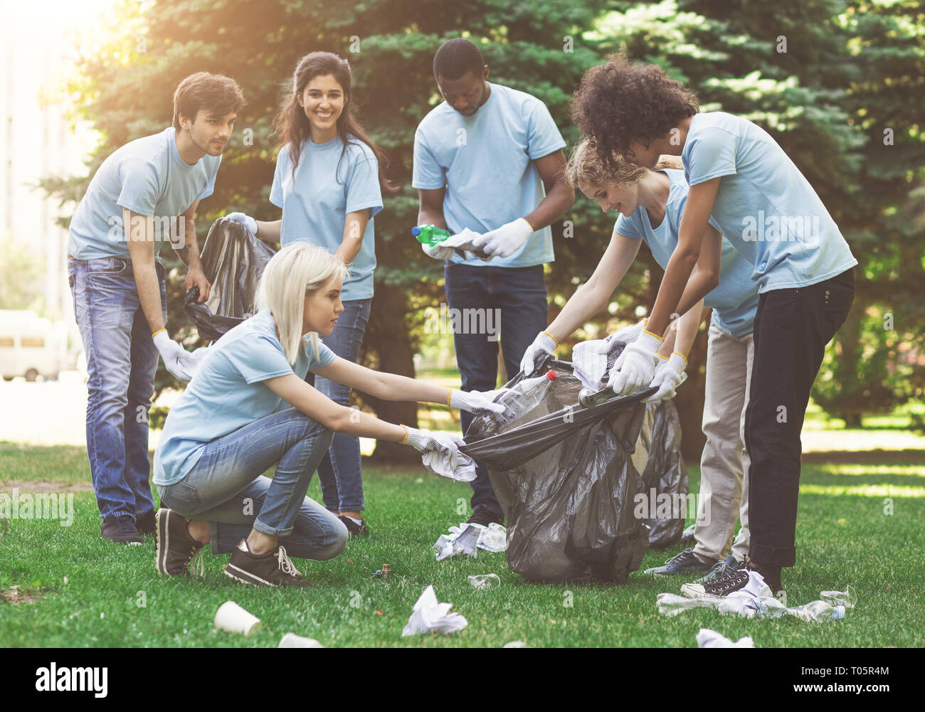 Young people collecting garbage hires stock photography and images Alamy