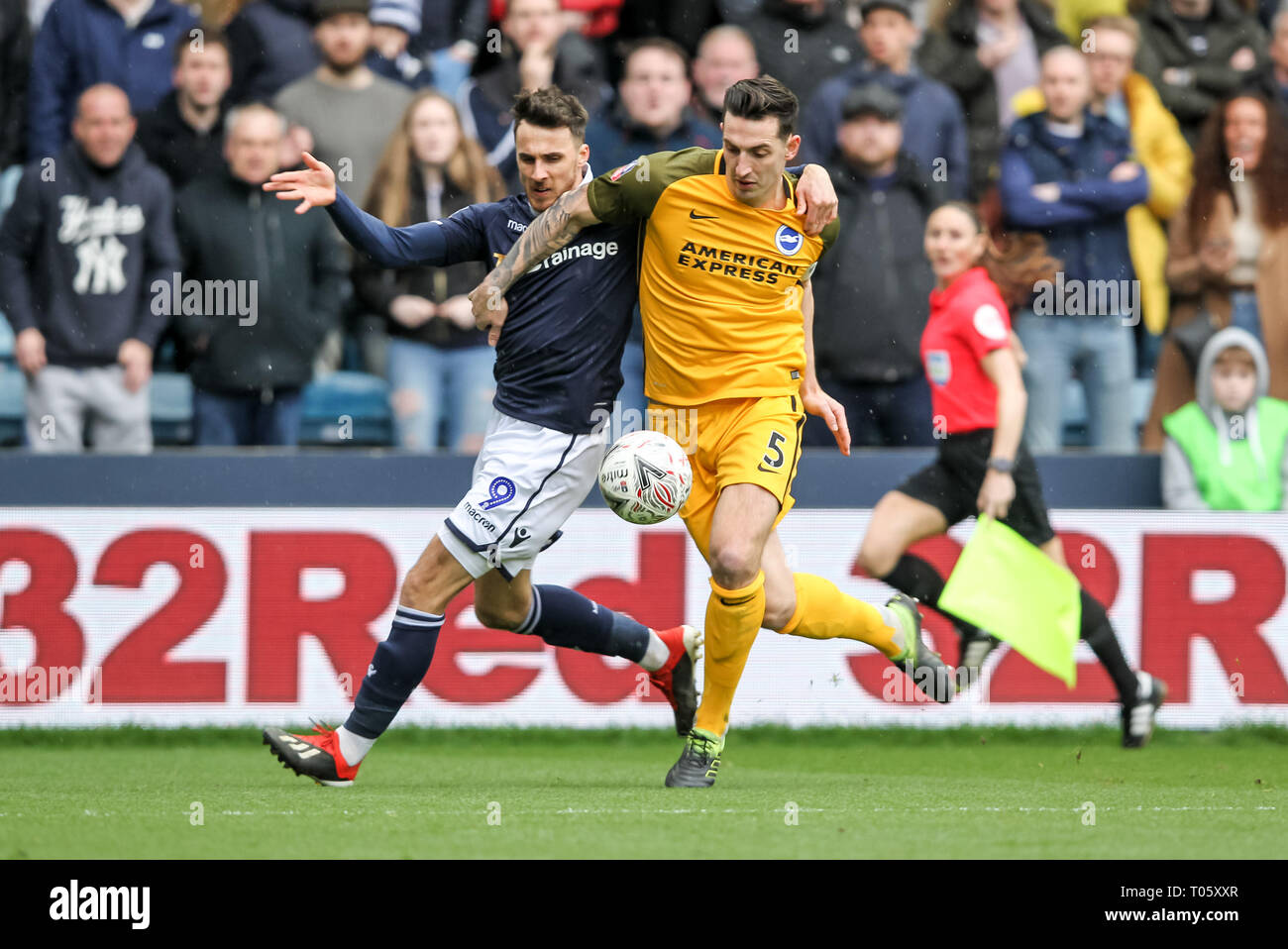 London, UK. 17th Mar, 2019. Lee Gregory of Millwall and Lewis Dunk of Brighton & Hove Albion tussle for the ball during the The FA Cup match between Millwall and Brighton and Hove Albion at The Den, London, England on 17 March 2019. Photo by Ken Sparks. Editorial use only, license required for commercial use. No use in betting, games or a single club/league/player publications. Credit: UK Sports Pics Ltd/Alamy Live News Credit: UK Sports Pics Ltd/Alamy Live News Credit: UK Sports Pics Ltd/Alamy Live News Stock Photo