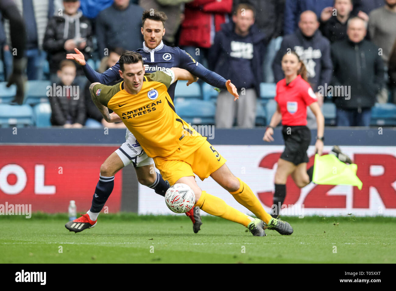 London, UK. 17th Mar, 2019. Lee Gregory of Millwall and Lewis Dunk of Brighton & Hove Albion tussle for the ball during the The FA Cup match between Millwall and Brighton and Hove Albion at The Den, London, England on 17 March 2019. Photo by Ken Sparks. Editorial use only, license required for commercial use. No use in betting, games or a single club/league/player publications. Credit: UK Sports Pics Ltd/Alamy Live News Credit: UK Sports Pics Ltd/Alamy Live News Credit: UK Sports Pics Ltd/Alamy Live News Stock Photo