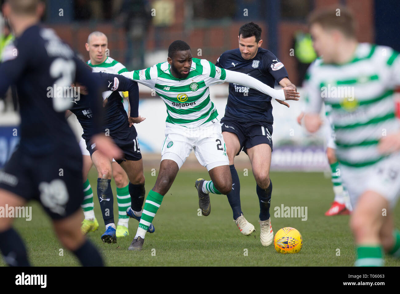 Dundee, UK. 17th Mar, 2019. Ladbrokes Premiership football, Dundee versus Celtic; Odsonne Edouard of Celtic challenges for the ball with Ryan McGowan of Dundee Credit: Action Plus Sports/Alamy Live News Stock Photo