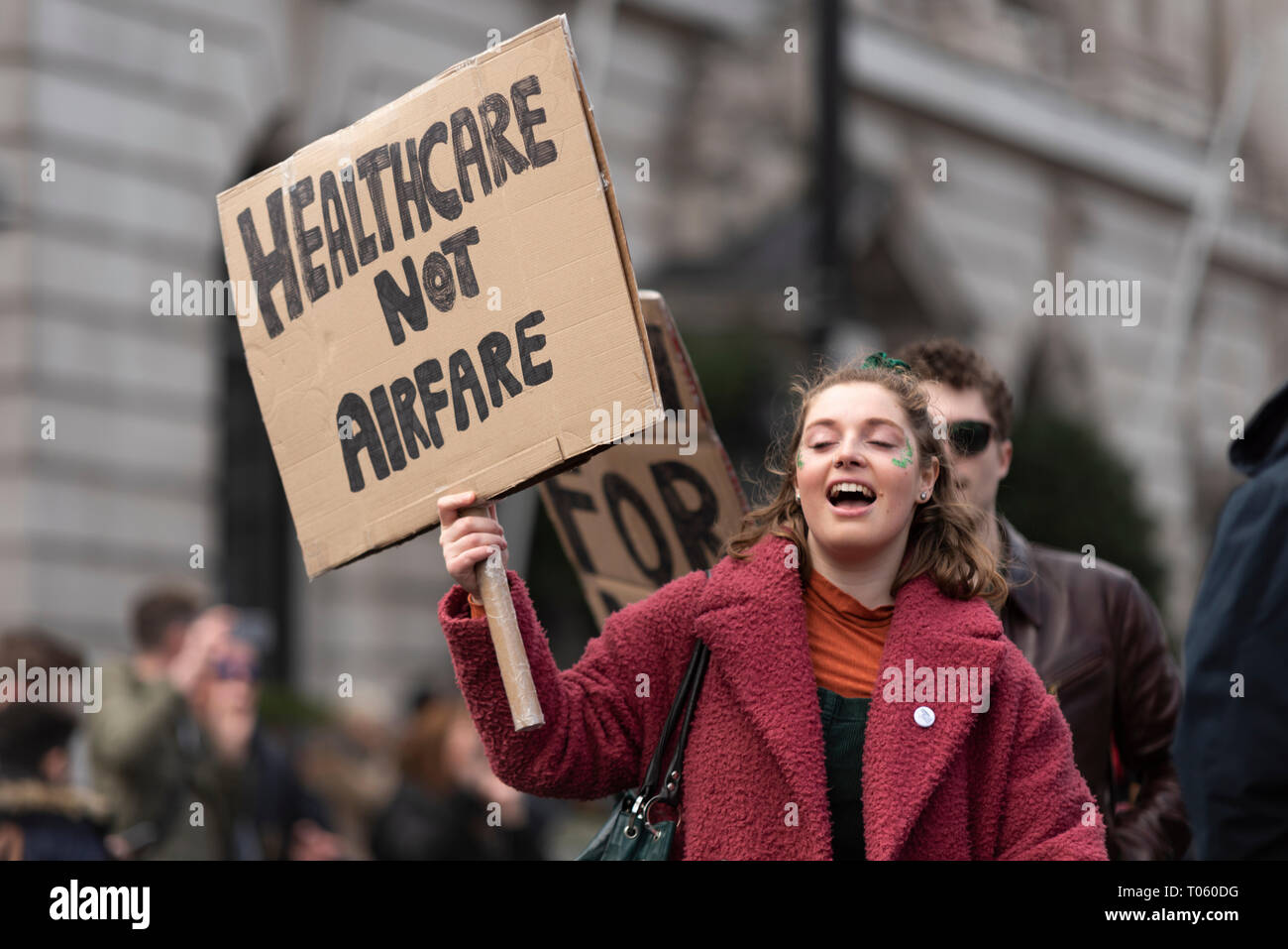 Traditional St Patrick's Day Parade through London, UK. London Irish Abortion rights campaign female with placard Healthcare not airfare Stock Photo