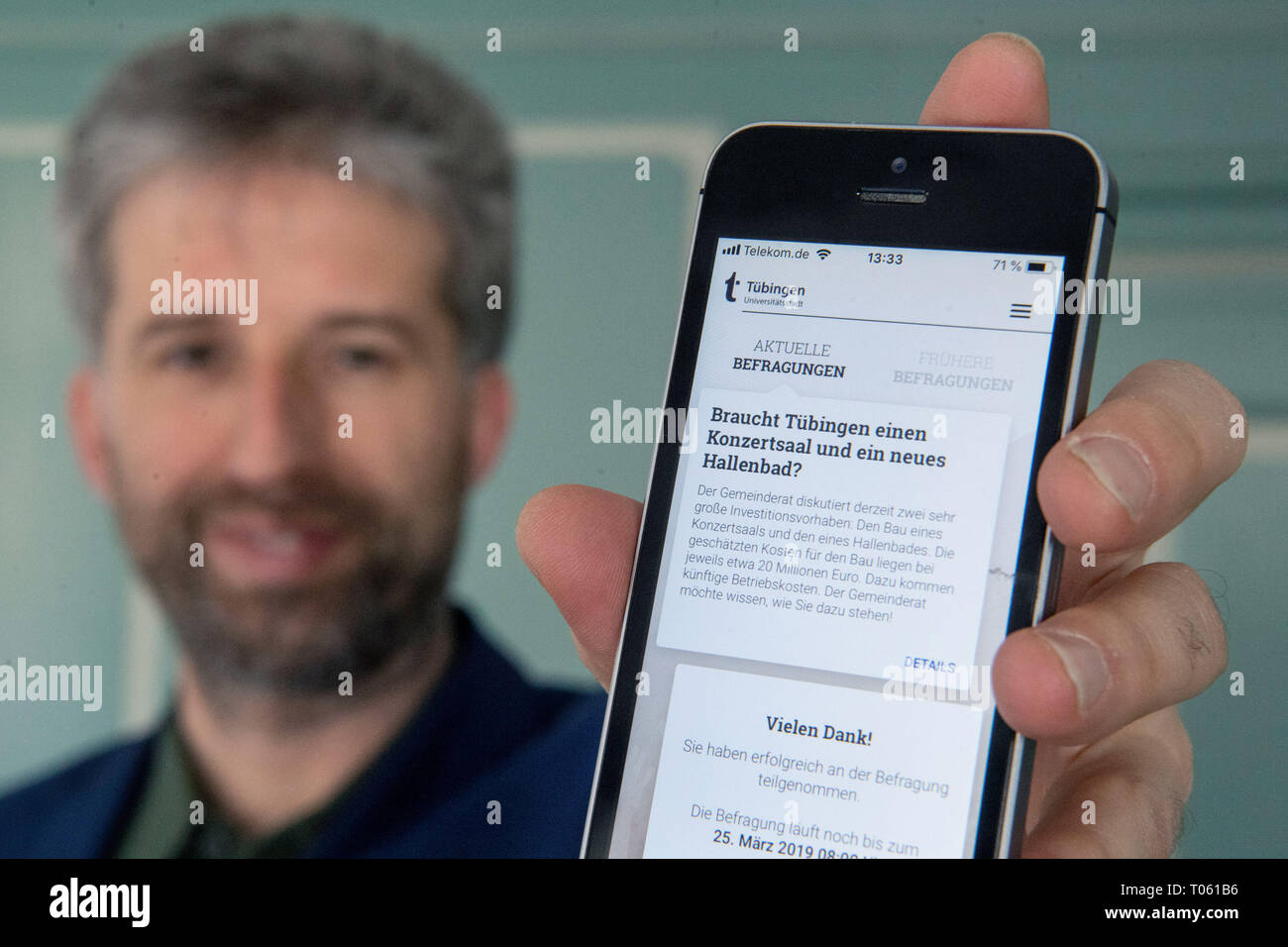 12 March 2019, Baden-Wuerttemberg, Tübingen: The mayor of Tübingen, the green politician Boris Palmer, shows the new application of citizen participation. Photo: Marijan Murat/dpa Stock Photo