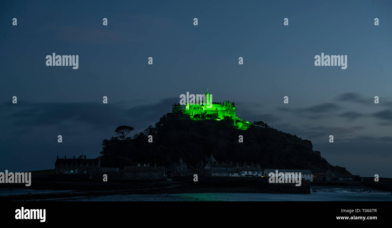 St Michael's Mount The Mount is lit up with green light to celebrate St Patrick's Day. Stock Photo