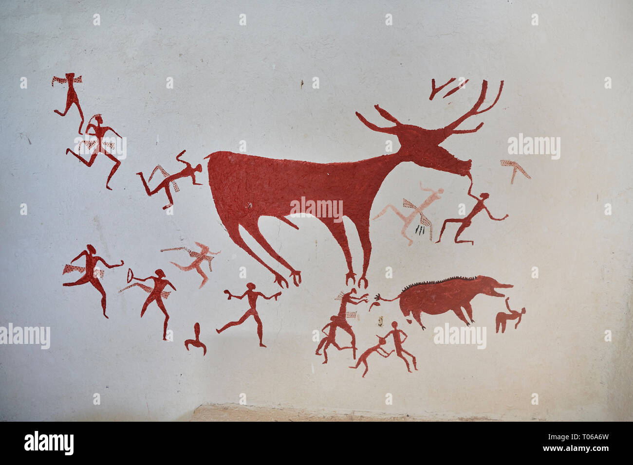 Recontructed fresco of an original found at Catalhoyuk. The men are hunting a deer and pulling on its tounge to disable it. The hunters are believed b Stock Photo