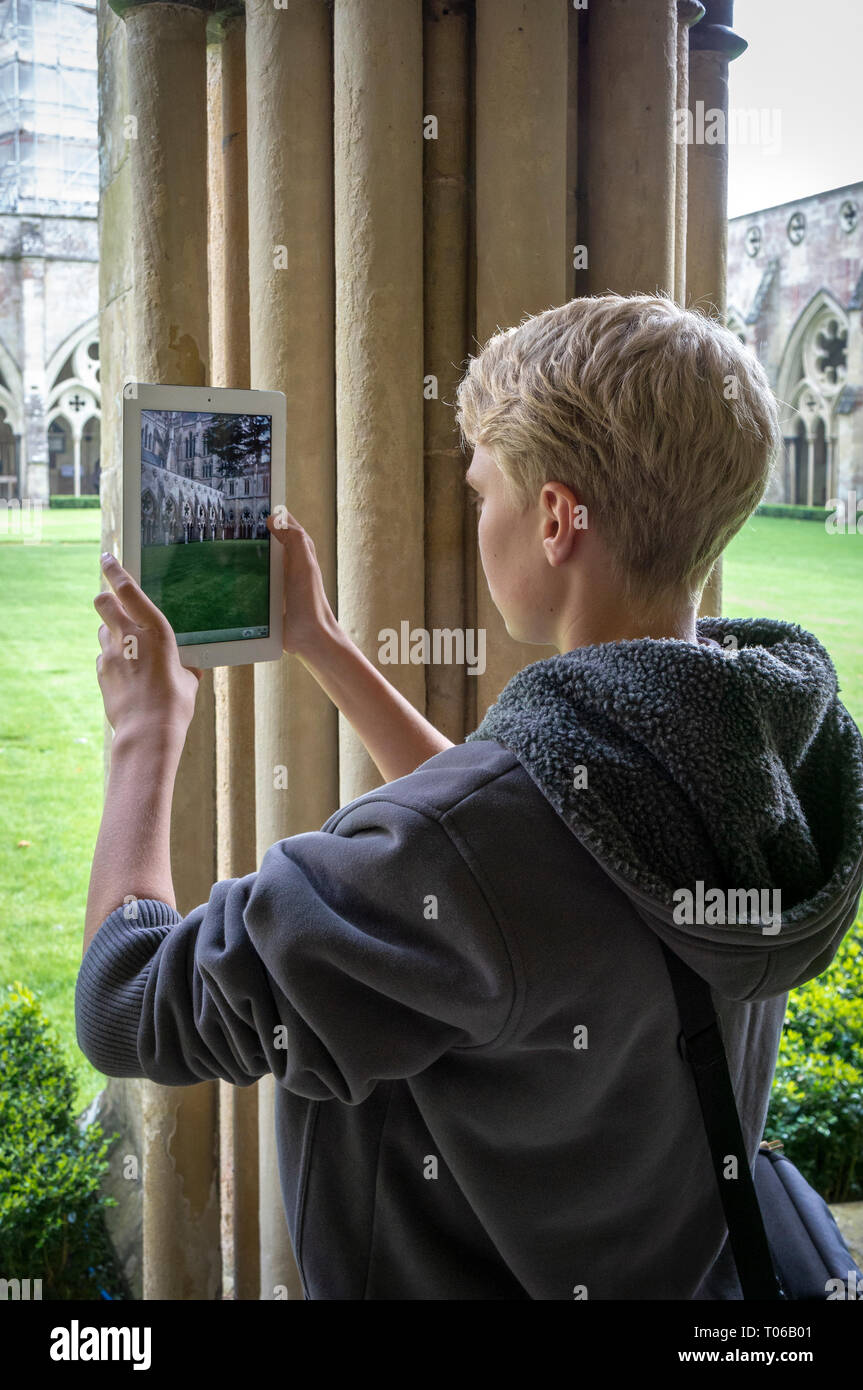 Young boy taking photographs with an iPad Stock Photo