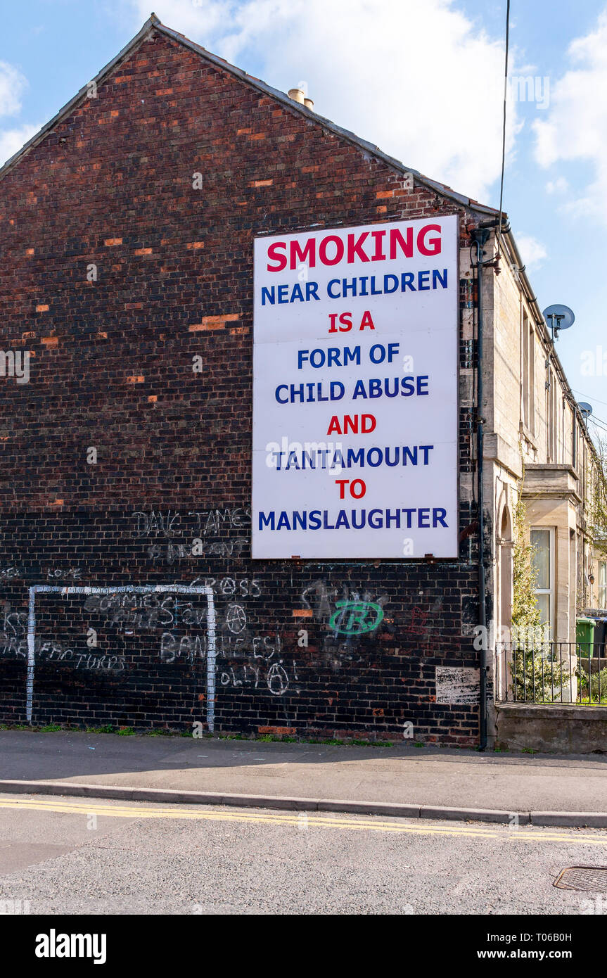 Anti smoking sign warning of the dangers of smoking tobacco near children Stock Photo