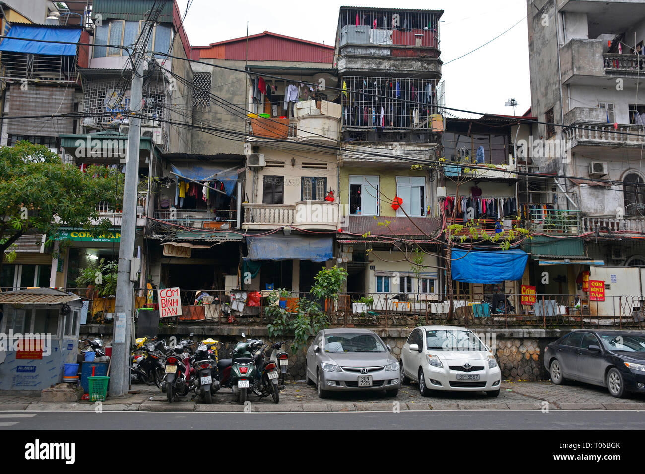 Hanoi, Vietnam - 14th December 2017. Houses on a residential street which is often referred to as Train Street in central Hanoi which has grown up aro Stock Photo