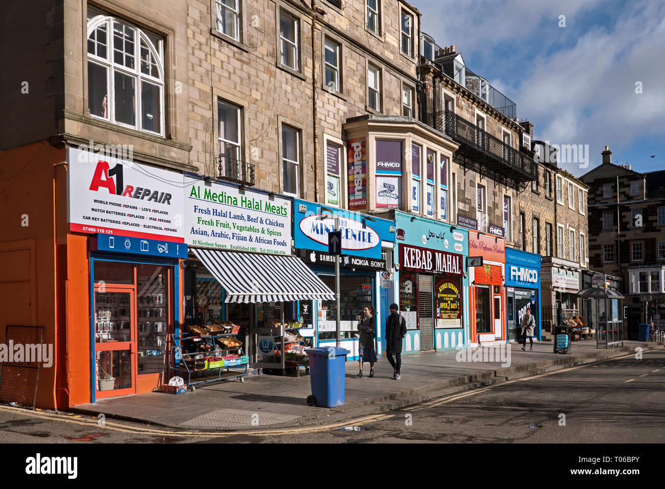 A variety of brightly coloured shops in Nicolson Square, Edinburgh, Scotland, UK. Stock Photo