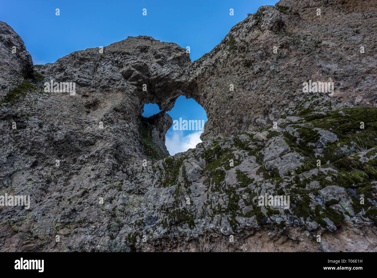 Eroded stone arch know as Ventana del nublo or La Agujereada. One of the higest places in Gran Canaria Island, Spain Stock Photo