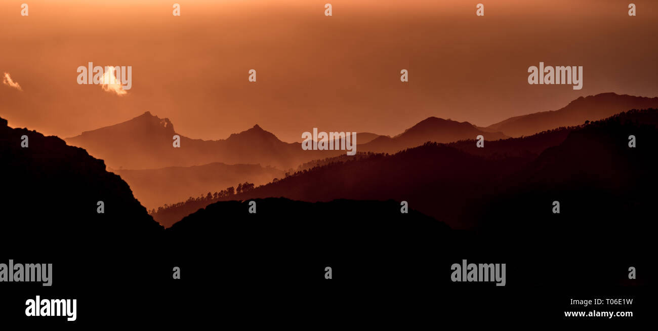 Sunset and mountain misty landscape panoramic view of Barranco de Tejeda and Barranco de la Culata, from La Ventana del nublo. One of the higest place Stock Photo