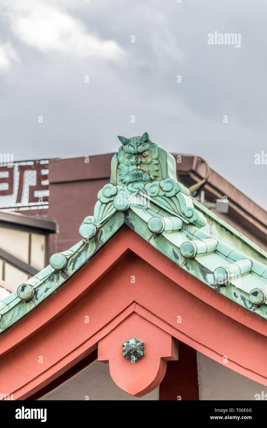 Onigawara 鬼瓦 (ogre goblin tile) roof ridge detail at Senso-ji temple. Located in Asakusa, Tokyo, Japan Stock Photo